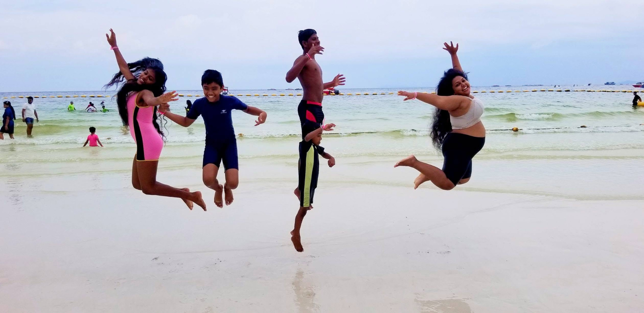 Yoga Ashram community enjoying a beach experience