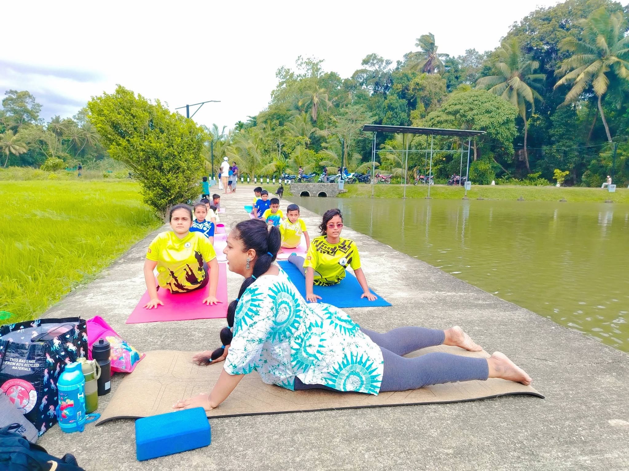 Outdoor yoga class beside water